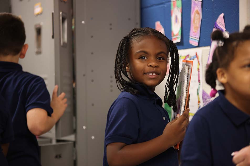 students and teacher working in classroom