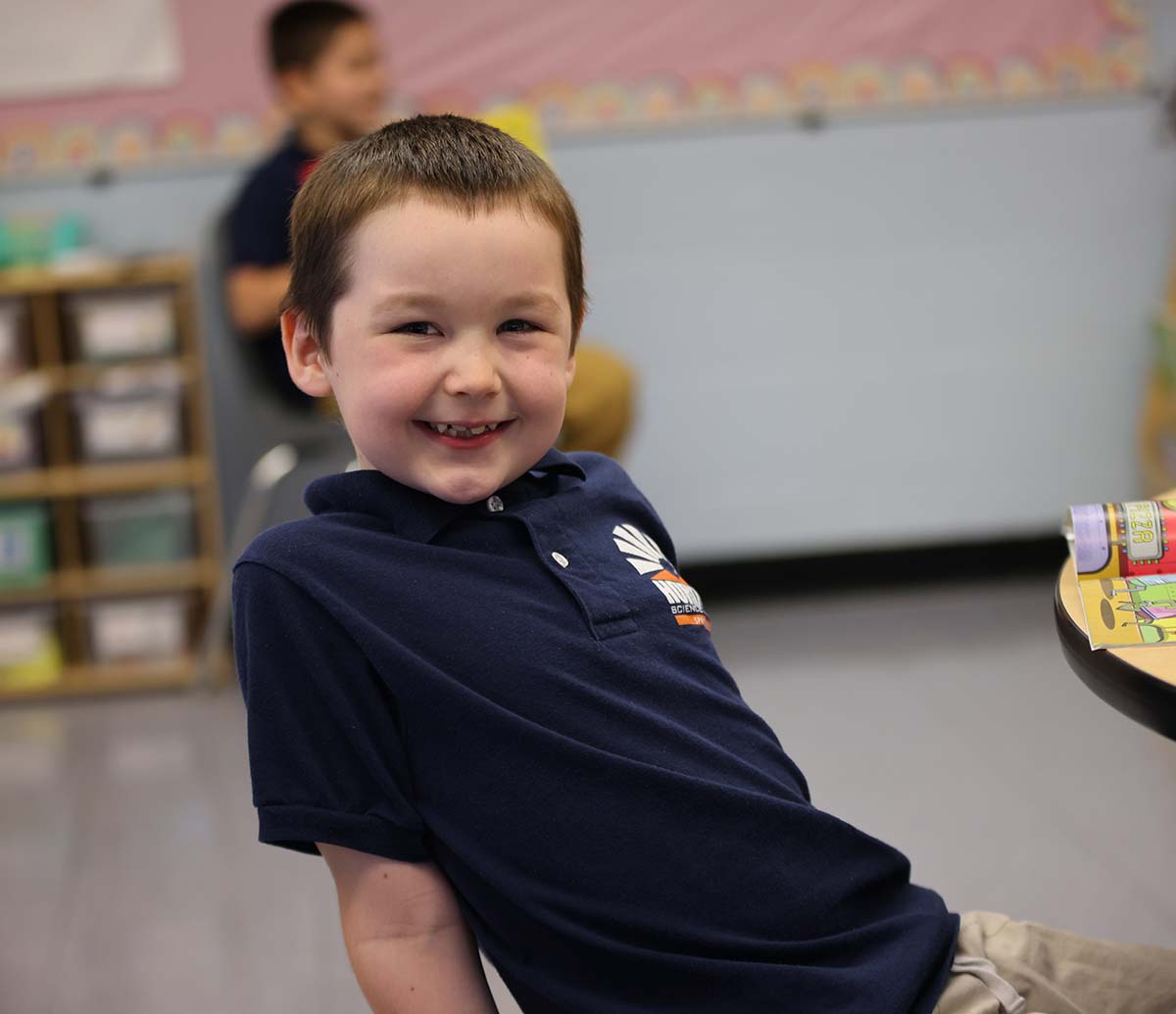 Teacher or school staff member warmly interacting with a student outside
